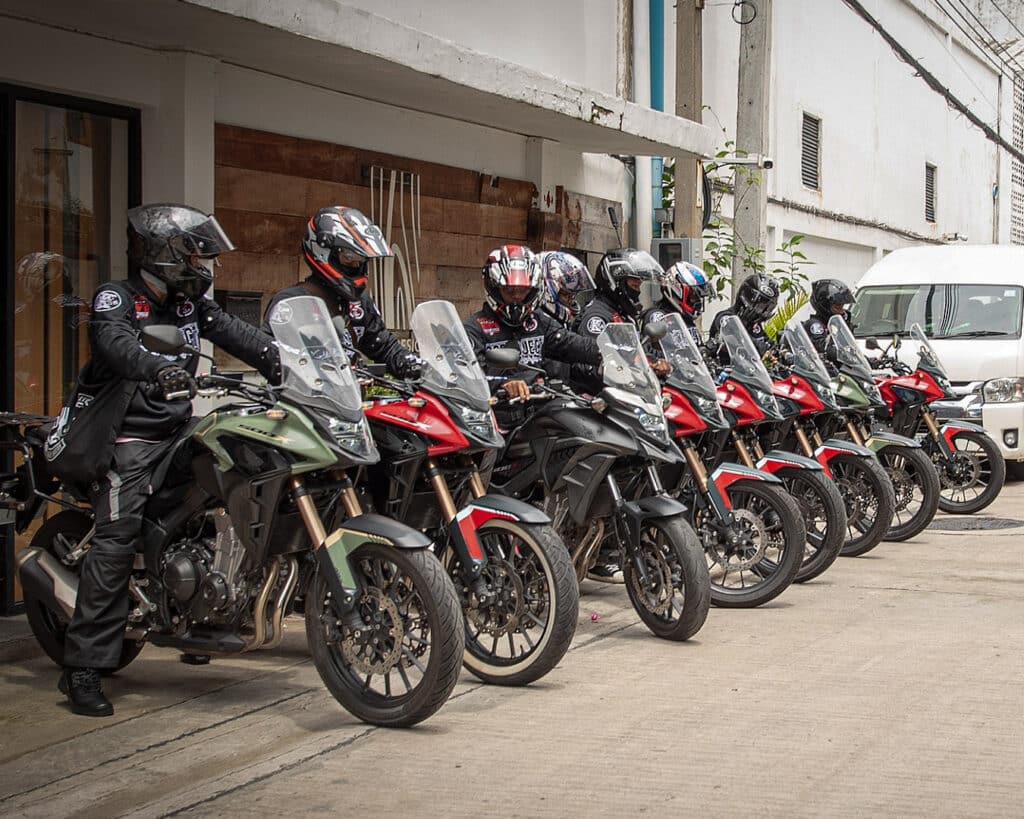 A group of riders on big bikes in front of rental shop